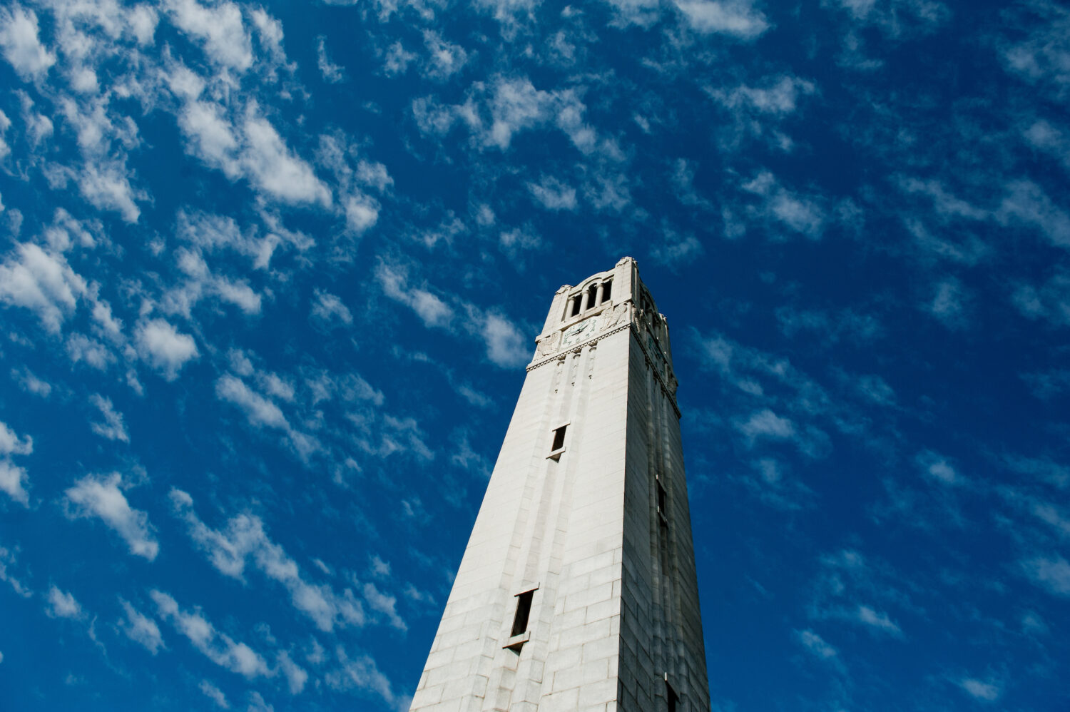 bell tower in front of blue sky