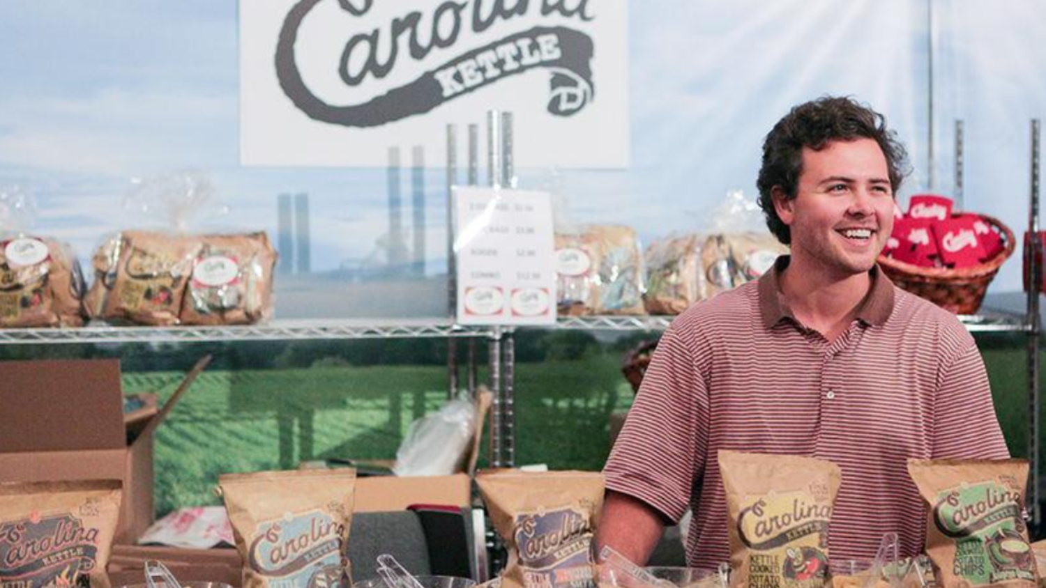 Josh Monahan with bags of Carolina Kettle Chips