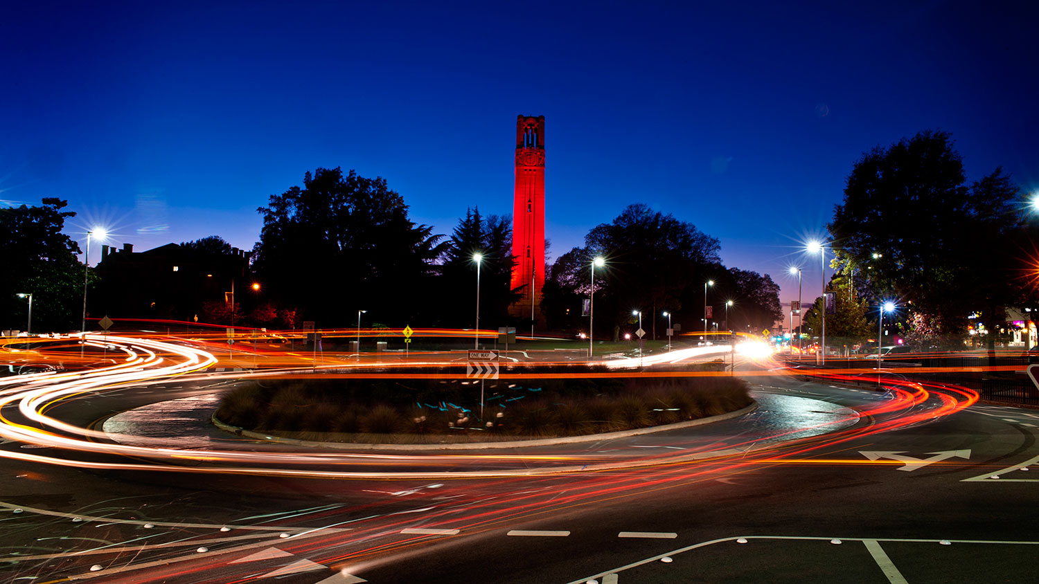 Lights spin around the Memorial Belltower, lit red to celebrate an athletic or academic success.