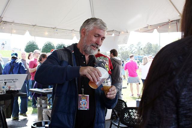 A person pouring a drink