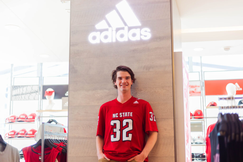 Student wearing an NC State jersey